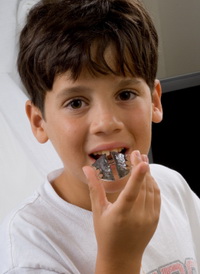 Boy with Retainer at the Pediatric Dentist Office in Casa Grande, Mesa and Chandler, AZ