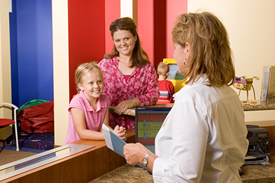 Child at Front Desk at the Pediatric Dentist Office in Casa Grande, Mesa and Chandler, AZ